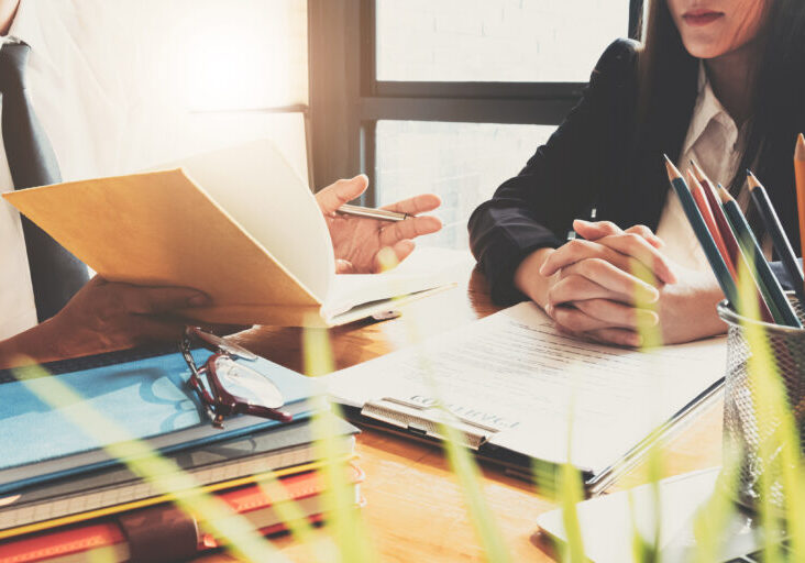 Business professionals. Close up group of young confident business people analyzing data in office